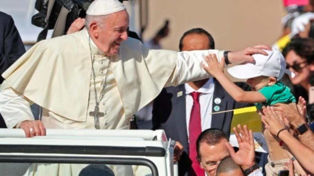 Pope Francis blesses a child as he arrives to lead a mass for an estimated 170,000 Catholics in Abu Dhabi during the first-ever papal visit to the Arabian Peninsula in February 2019. — AFP