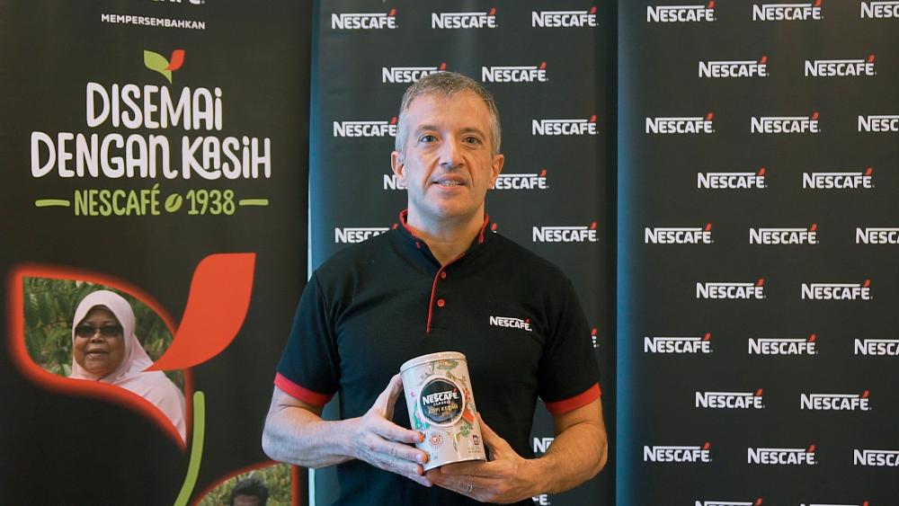 Nestle Malaysia CEO Juan Aranols holds a can of NESCAFE Classic Kopi Kedah.