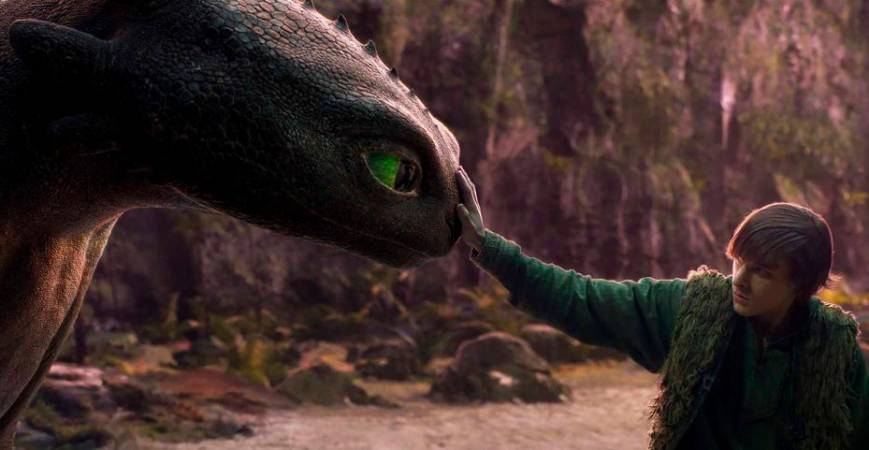 Hiccup (Thames) shares a quiet moment with Toothless in a breathtaking live-action reimagining of their iconic bond.