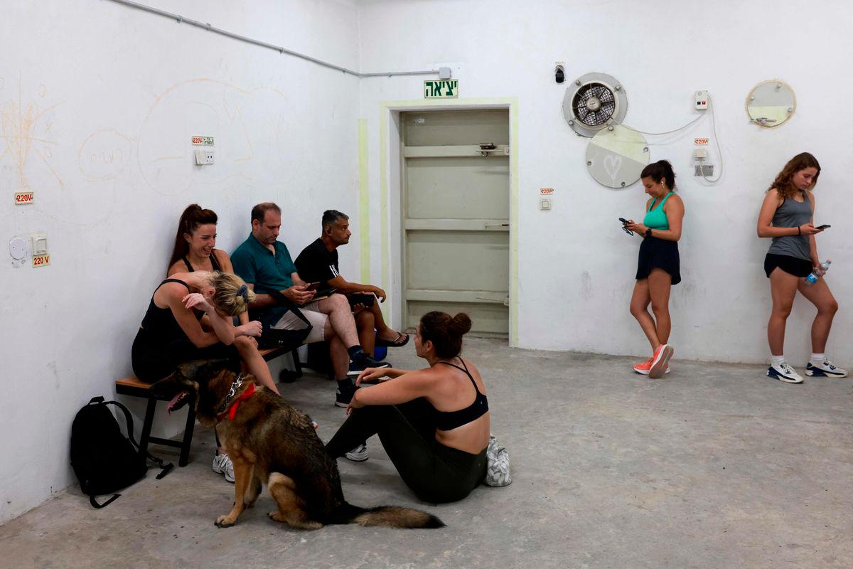 With missiles overhead, Tel Aviv residents huddle underground