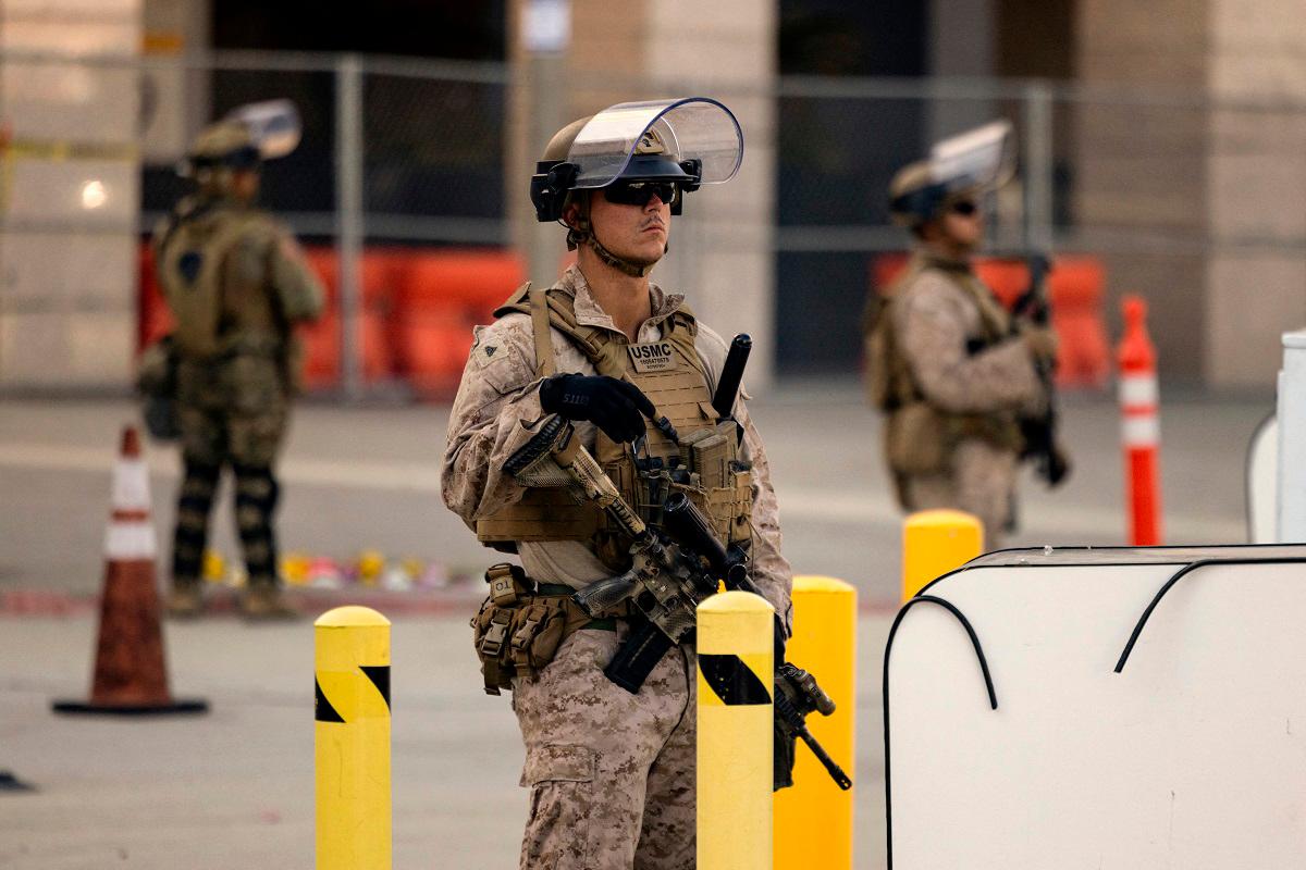 Curfew lifted in LA as Trump battles for control of California troops