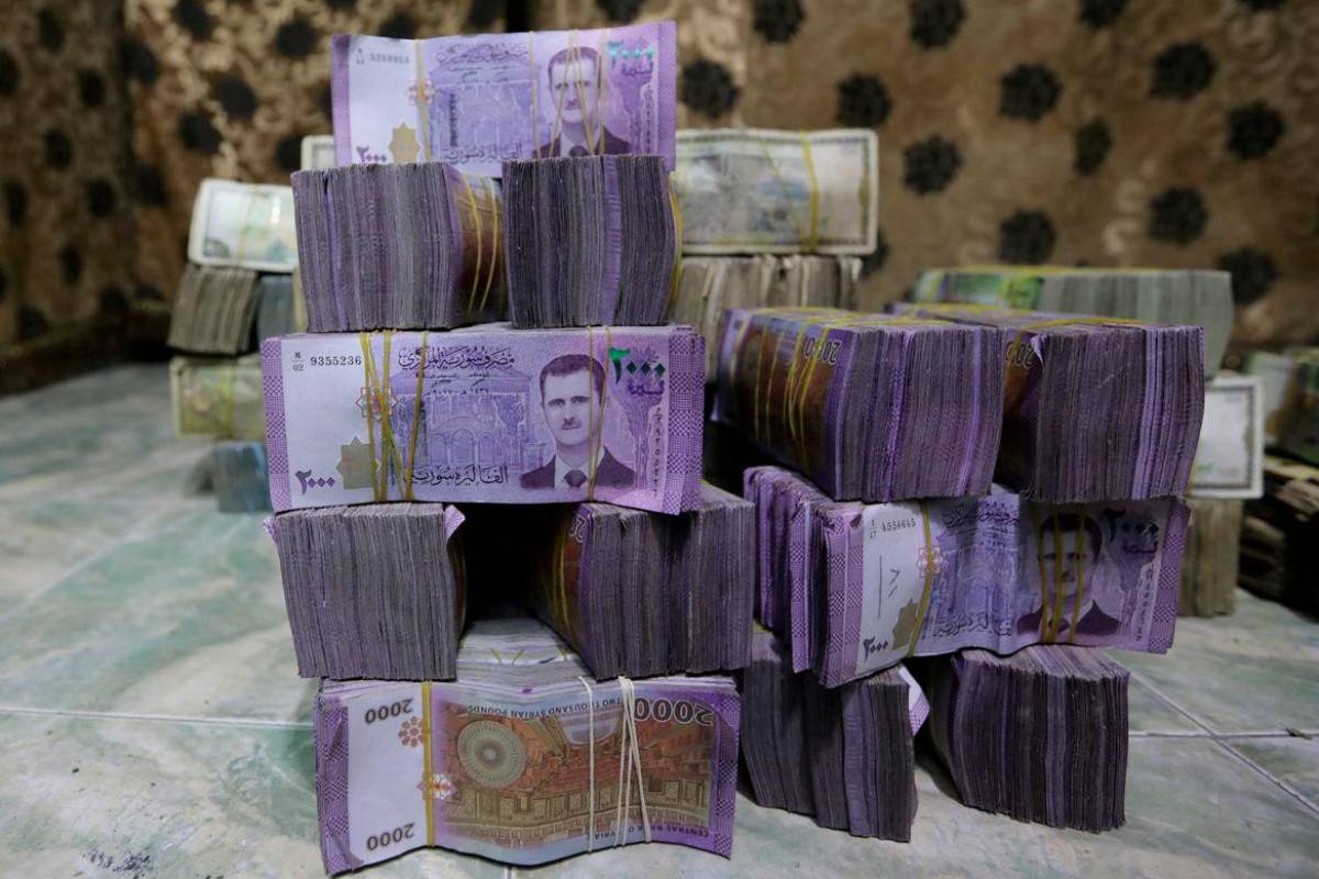 Syria to revalue currency by removing two zeros to restore stability