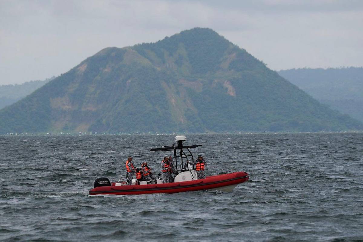 Search for missing cockfighters begins at Philippine lake