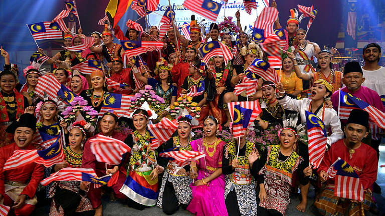 Participants of the Malaysia Day celebrations pose for a photo, at Stadium Perpaduan in Petra Jaya, on Sept 16, 2019.