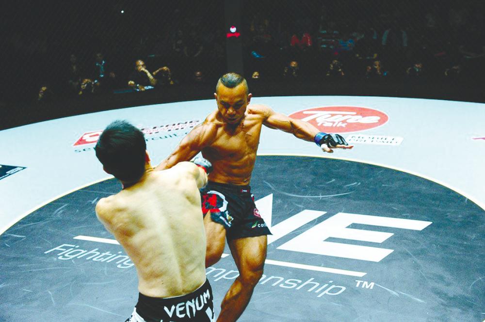 AJ recently auctioned off his prized mixed martial arts fighting gloves to help two friends who were critically ill. – Picture courtesy of ONE Championship