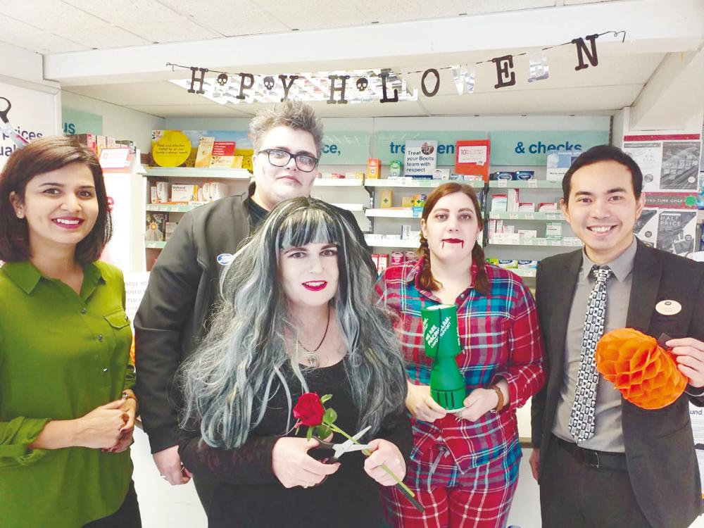 Amirul (far right) works at the Boots pharmacy in Selsey, England, and was named Best Pharmacist (Customer Service) for the region in 2018.