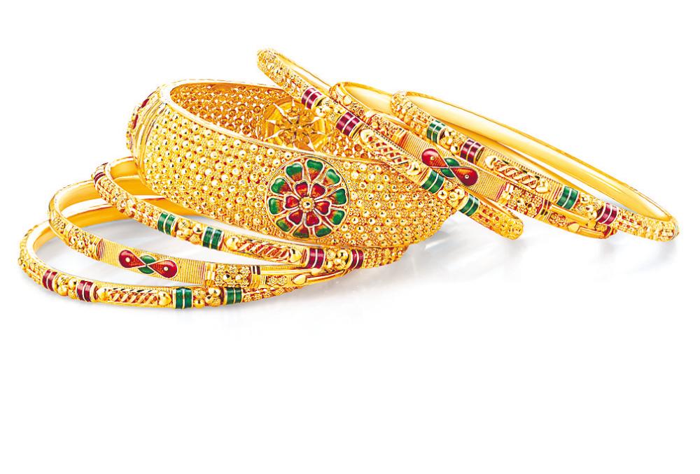 A set of charming bangles made from 916/22k gold and adorned with colourful enamel pieces from the Bombay Collection. – POH KONG