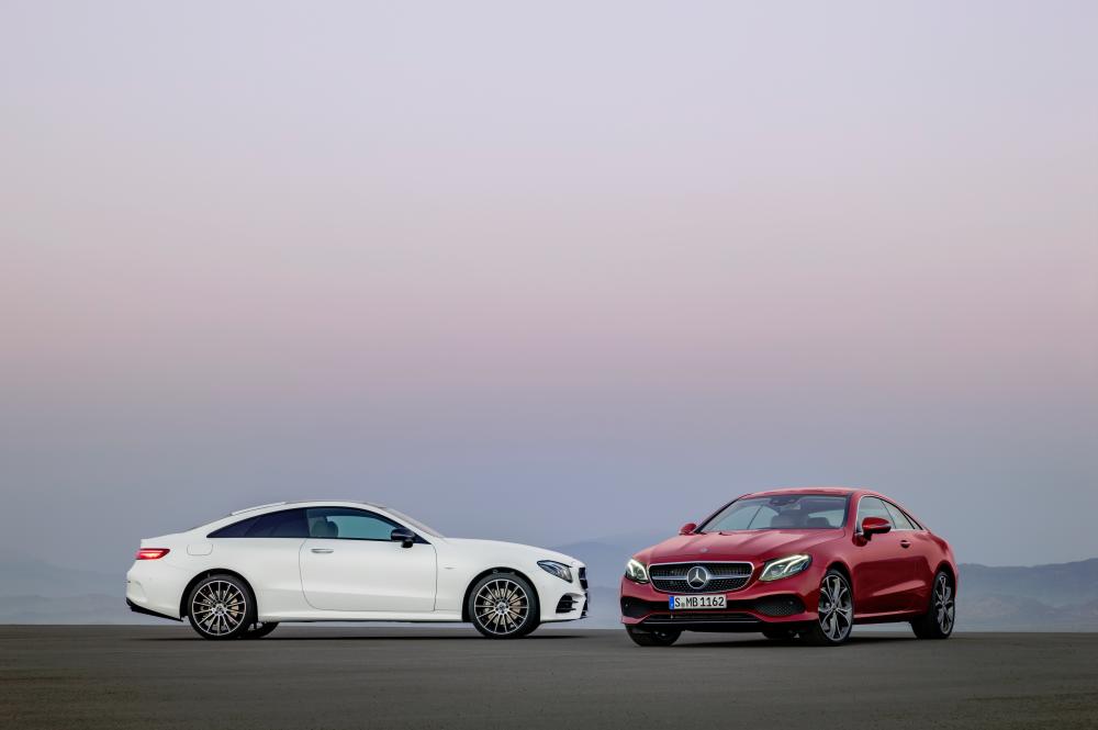 $!A 2016 E-Class Coupe ‘Avantgarde’ variant, model series C238, in designo hyacinth red metallic (right) and another C238 model series 2016 E-Class Coupe Edition 1, albeit an ‘AMG Line’ variant in ‘Night Package’, and in cashmir white magno body colour.
