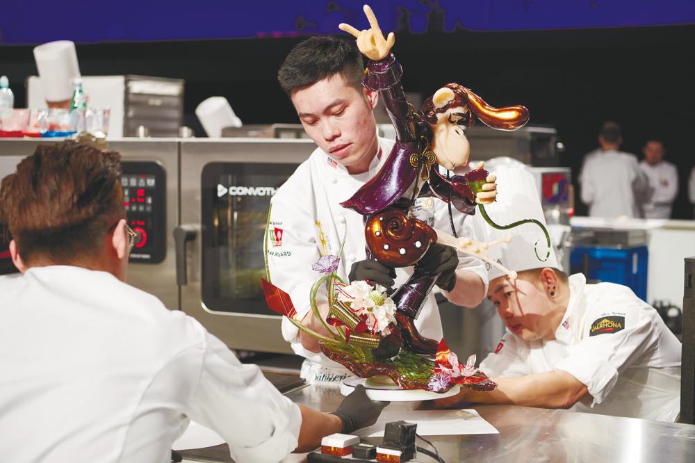Chef Tan taking part in a pastry competition. – Courtesy of Tan Wei Loon