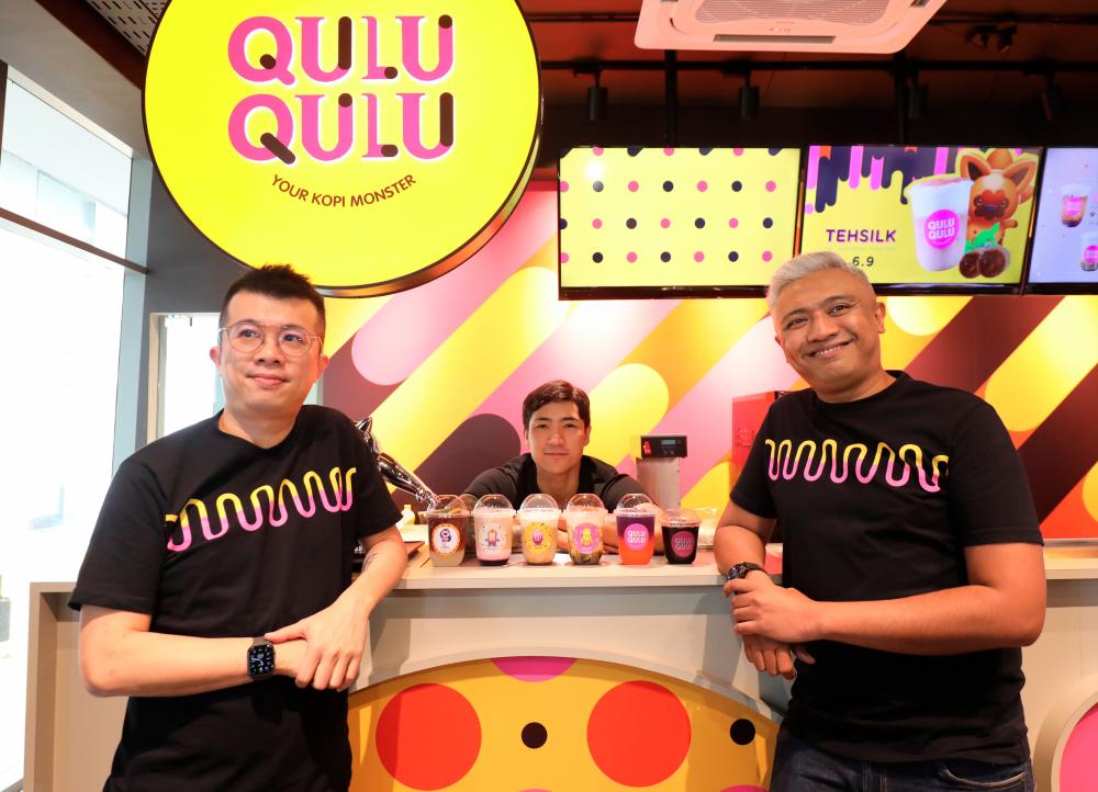 John (right) and Zain (far right) with a sampling of the drinks at Qulu Qulu. – ASYRAF RASID/THESUN
