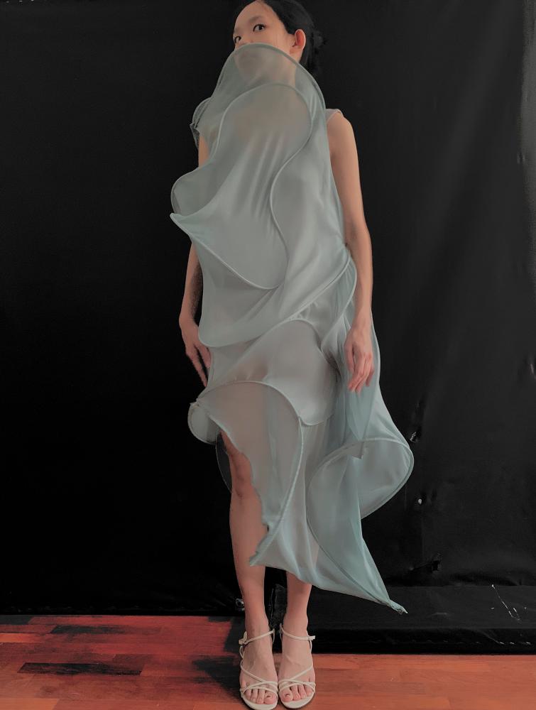 $!A twisted sculp dress. – COURTESY OF CARO CHIA