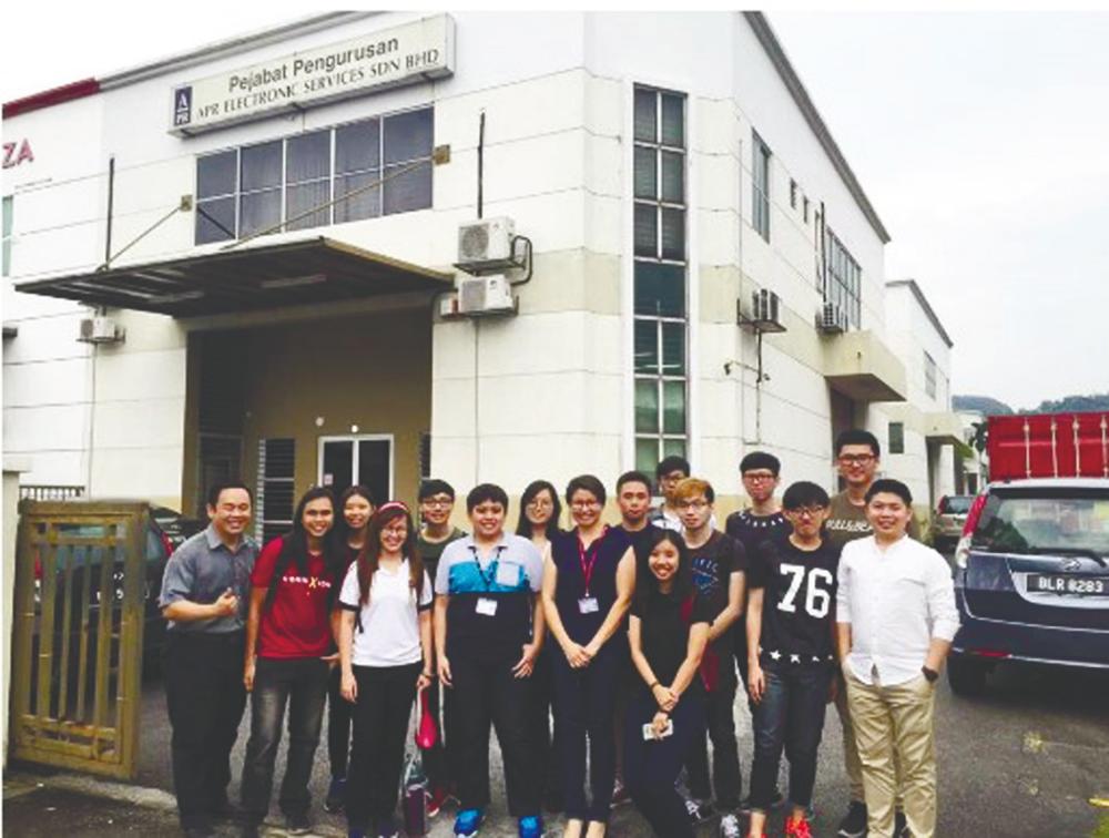 Head of Programme for Master of Information Systems Dr Wong Whee Yen (front row, fifth from left) with students at APR Electronic Services Sdn Bhd.