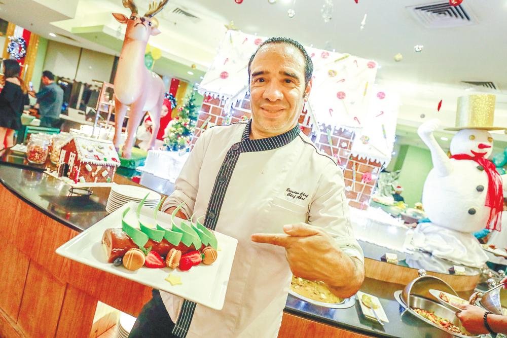 Michelin-star Chef Abri with a yule log. — Sunpix by Amirul Syafiq Mohd Din