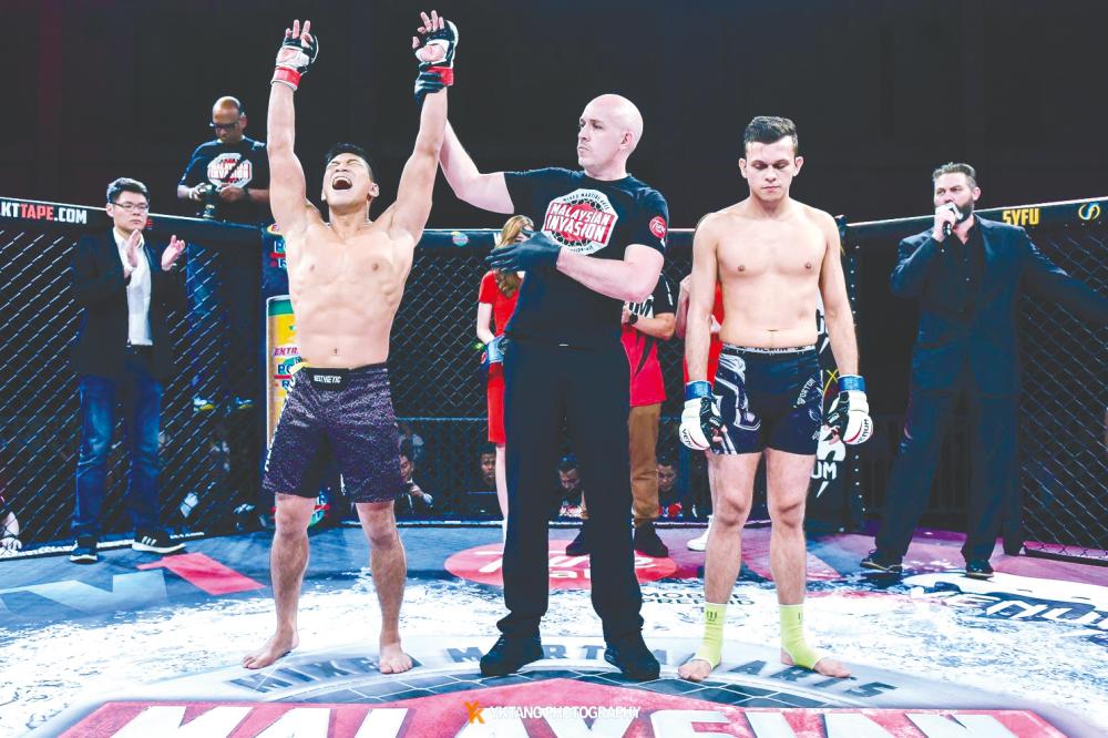 Soo celebrating one of his wins in the MMA ring. – Courtesy of YK Tang Photography $!Soo celebrating one of his wins in the MMA ring. – Courtesy of YK Tang Photography