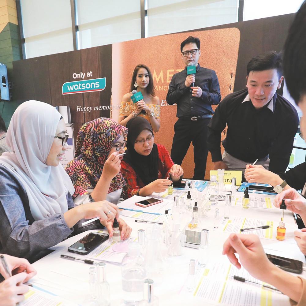Guests were guided by Lee (second from right) on how to create their very own fragrance.