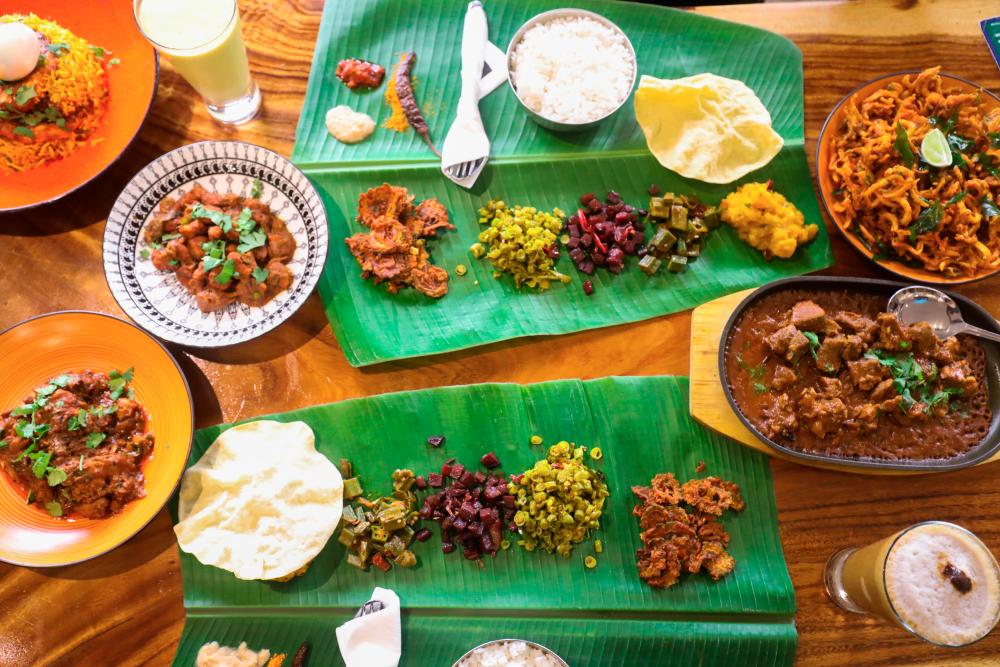 The vibrant banana leaf spread. – ALL PIX BY AMIRUL SYAFIQ MOHD DIN/THESUN