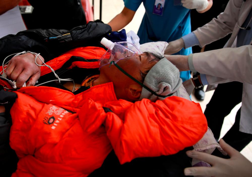Malaysian climber Wui Kin Chin is being transferred from a helicopter to the hospital for treatment after being rescued form Mount Annapurna in Kathmandu, Nepal April 26, 2019. — Reuters