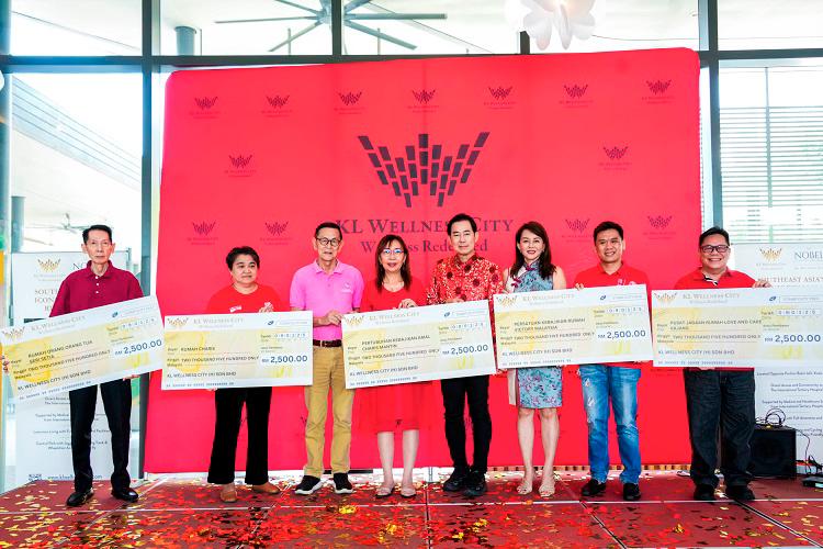 $!Kok (fourth from left) and Lee (fifth from left) with representatives from the old folks homes.