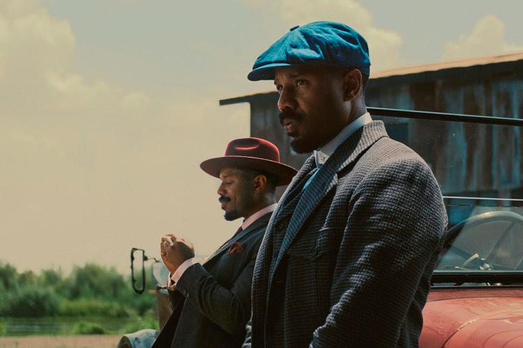 Jordan takes on dual duties playing Stack (left) and Smoke. – ALL PICS FROM WARNER BROS PICTURES