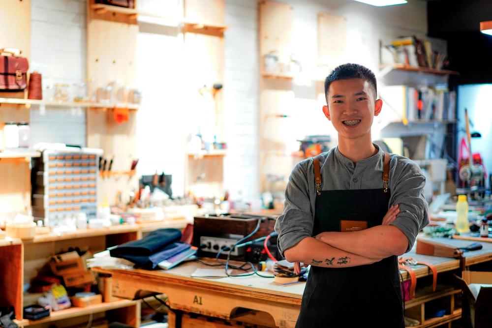 Graphic design graduate Zi Xian co-founded Tyde in 2015 out of his passion for leathercraft. – NORMAN HIU/THESUN