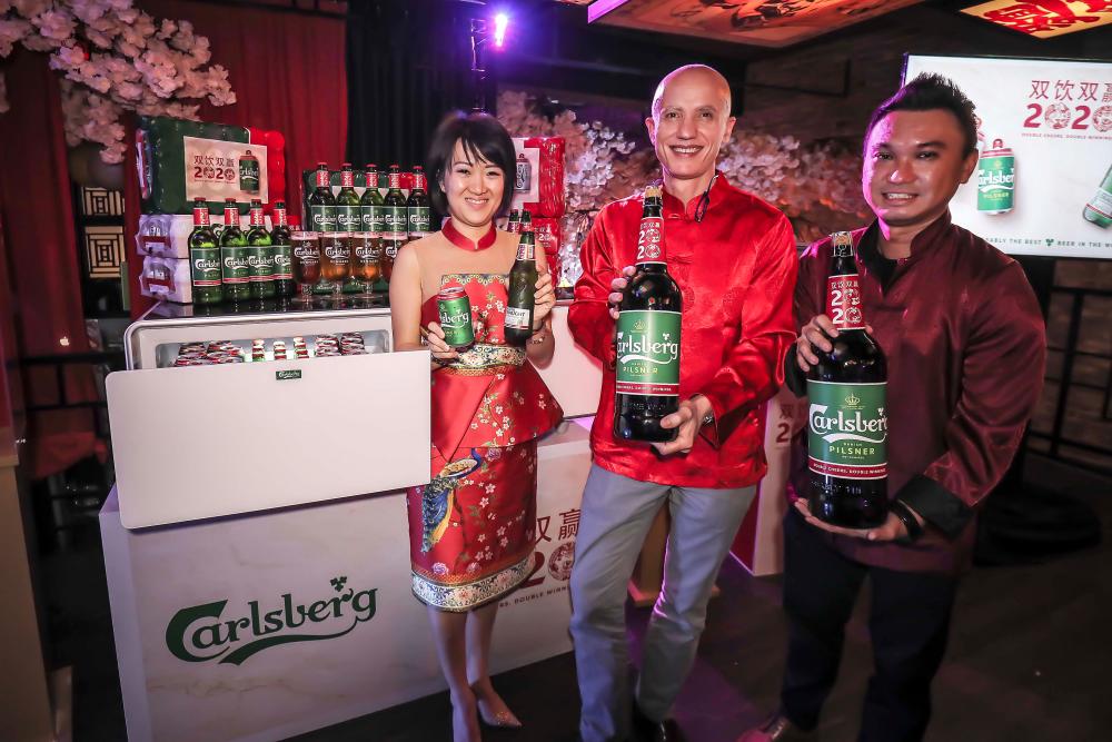 From left: Carlsberg Malaysia Corporate Communications &amp; CSR Director Pearl Lai, Clini and Choo were present at the exclusive media preview of the “Double Cheers. Double Winnings.” campaign. — ADIB RAWI YAHYA/THESUN