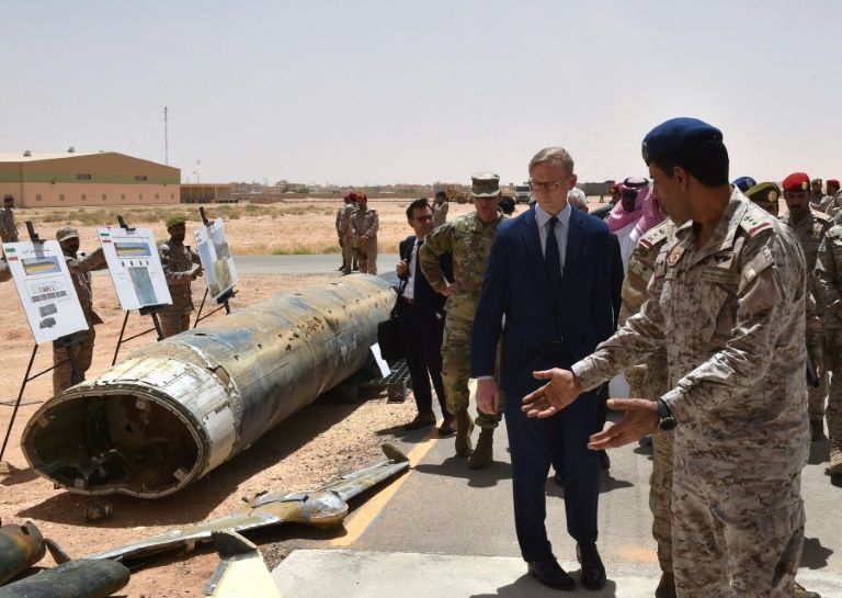 A US representative inspects what Saudi officials said were Huthi missiles and drones intercepted over Saudi territory. — AFP