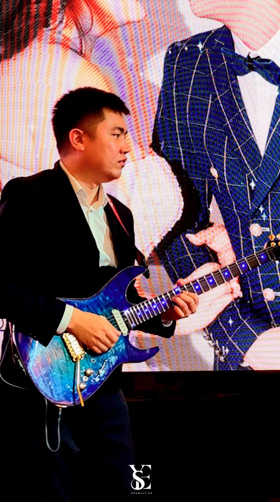 $!Eugene decided to add electric and LED guitar performances to create a better wedding experience for clients.