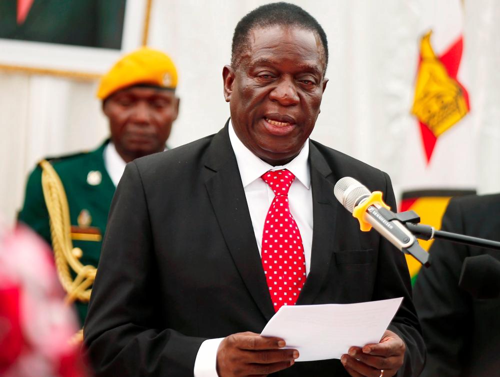 Zimbabwean President Emmerson Mnangagwa officiates at the swearing in ceremony for his cabinet at State House in Harare, Zimbabwe on Dec 4, 2017. — Reuters
