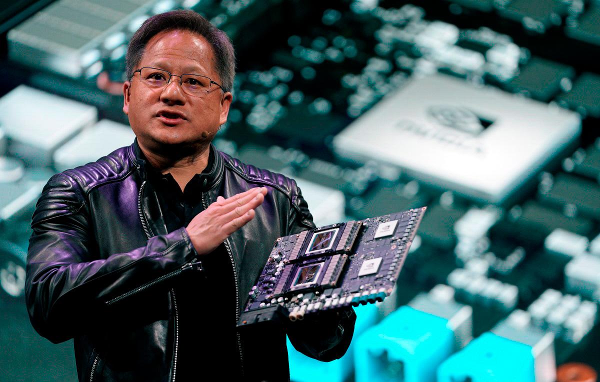 - Jensen Huang, CEO of Nvidia, shows the Drive Pegasus robotaxi AI computer at his keynote address at CES in Las Vegas, Nevada, U.S. January 7, 2018. REUTERS/Rick Wilking