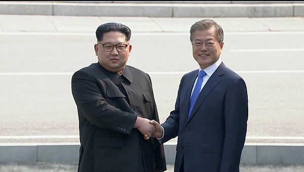 North Korean leader Kim Jong Un shakes hands with South Korean President Moon Jae-in at the truce village of Panmunjom, South Korea on April 27, 2018. — Reuters