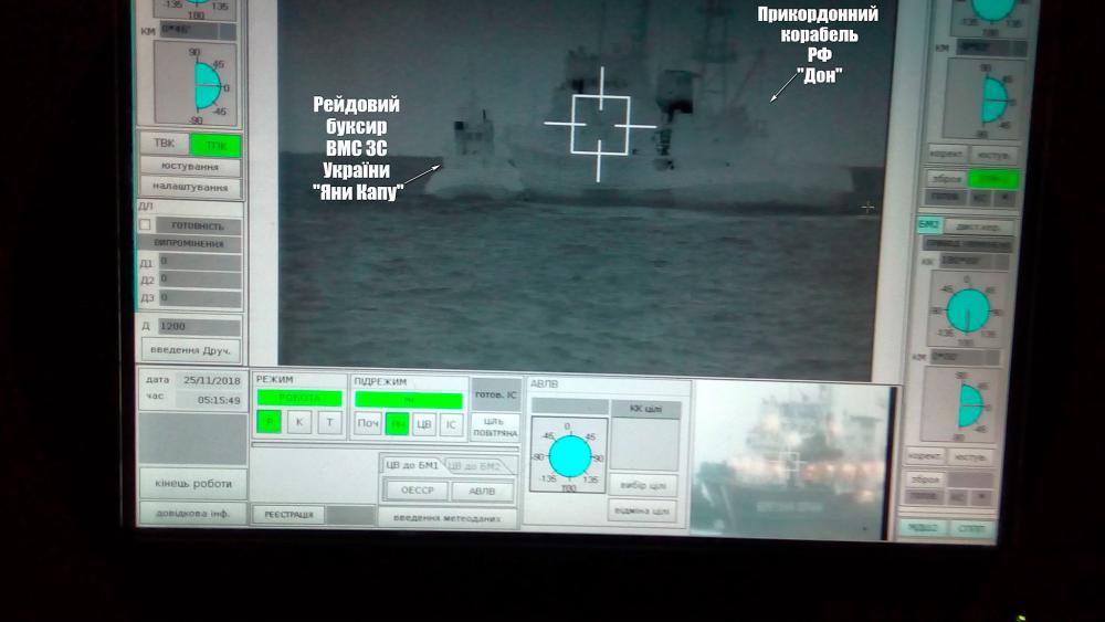 A screen shows a Russian border guard vessel Don trying to stop a Ukrainian Navy tug boat as three Ukrainian ships make a journey from the Black Sea port of Odessa via the Kerch Strait to Mariupol on the Sea of Azov, in the Black Sea in this handout picture taken Nov 25, 2018 and released by the Ukrainian Navy. — Ukrainian Navy / Reuters