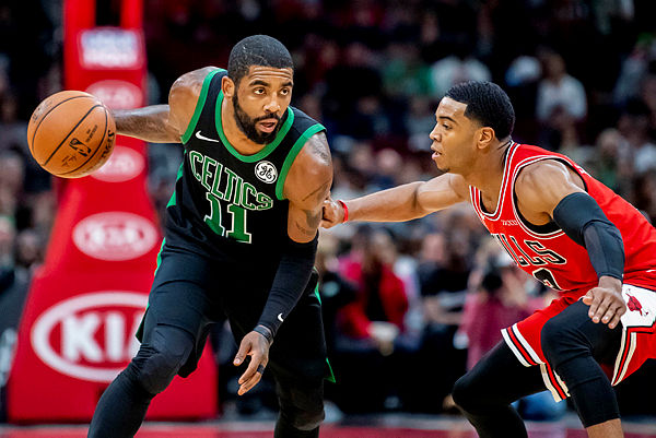 Boston Celtics guard Kyrie Irving (11) controls the ball during the first half against the Chicago Bulls at the United Center. — Reuters