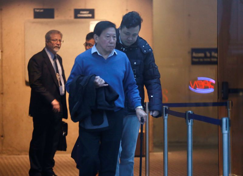 Liu Xiaozong (rear R), husband of Huawei CFO Meng Wanzhou, returns to his wife’s B.C. Supreme Court bail hearing after a lunch recess in Vancouver, British Columbia, Canada, on Dec 11, 2018. — Reuters