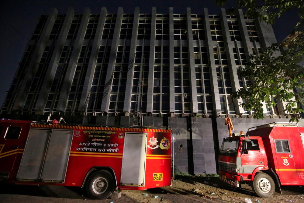 Fire engines are parked in front of a partially damaged hospital after it caught fire in the suburbs of Mumbai, India, Dec 17, 2018. — Reuters