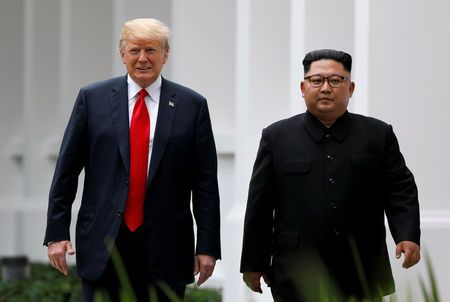 US President Donald Trump and North Korean leader Kim Jong Un walk after lunch at the Capella Hotel on Sentosa island in Singapore June 12, 2018. — Reuters