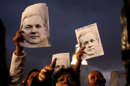 Supporters of WikiLeaks founder Julian Assange demonstrate in front of presidential palace regarding his Ecuadorian citizenship, in Quito, Ecuador, Oct 31, 2018. — Reuters