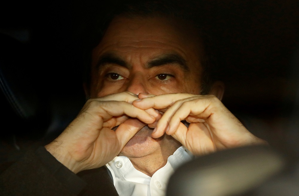 Former Nissan Motor Chairman Carlos Ghosn sits inside the car as he leaves his lawyer’s office after being released on bail from Tokyo Detention House, in Tokyo March 6, 2019. — Reuters