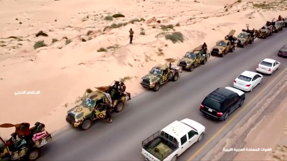 An aerial view shows military vehicles on a road in Libya, April 4, 2019, in this still image taken from video. — Reuters