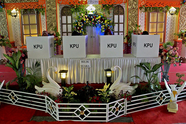 People vote at a polling center designed to look like a traditional wedding ceremony during elections in Semarang, Central Java province, Indonesia, April 17, 2019 in this photo taken by Antara Foto. — Reuters