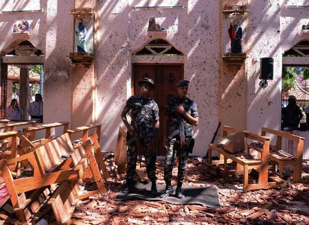 Sri Lankan military stand guard inside a church after an explosion in Negombo, Sri Lanka April 21, 2019. — Reuters