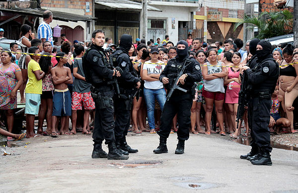 Policemen are seen at a site where, according to local media, an armed group entered and opened fire at a bar, killing and wounding its patrons, in Belem, Para state, Brazil May 19, 2019. - Reuters