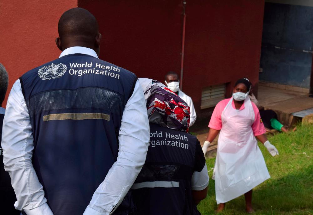 World Health Organization (WHO) officials talk to Ugandan medical staff as they inspect ebola preparedness facilities at the Bwera general hospital near the border with the Democratic Republic of Congo in Bwera, Uganda. — Reuters