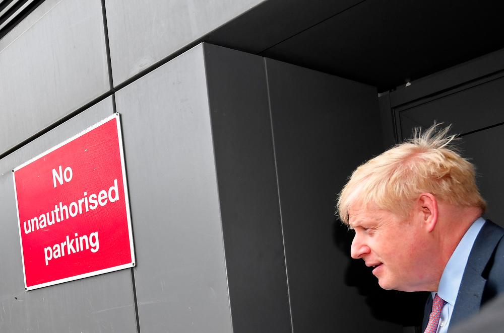 Boris Johnson (Pix), leadership candidate for Britain’s Conservative Prime Minister, leaves a hustings event via a side entrance in London, Britain. — Reuters