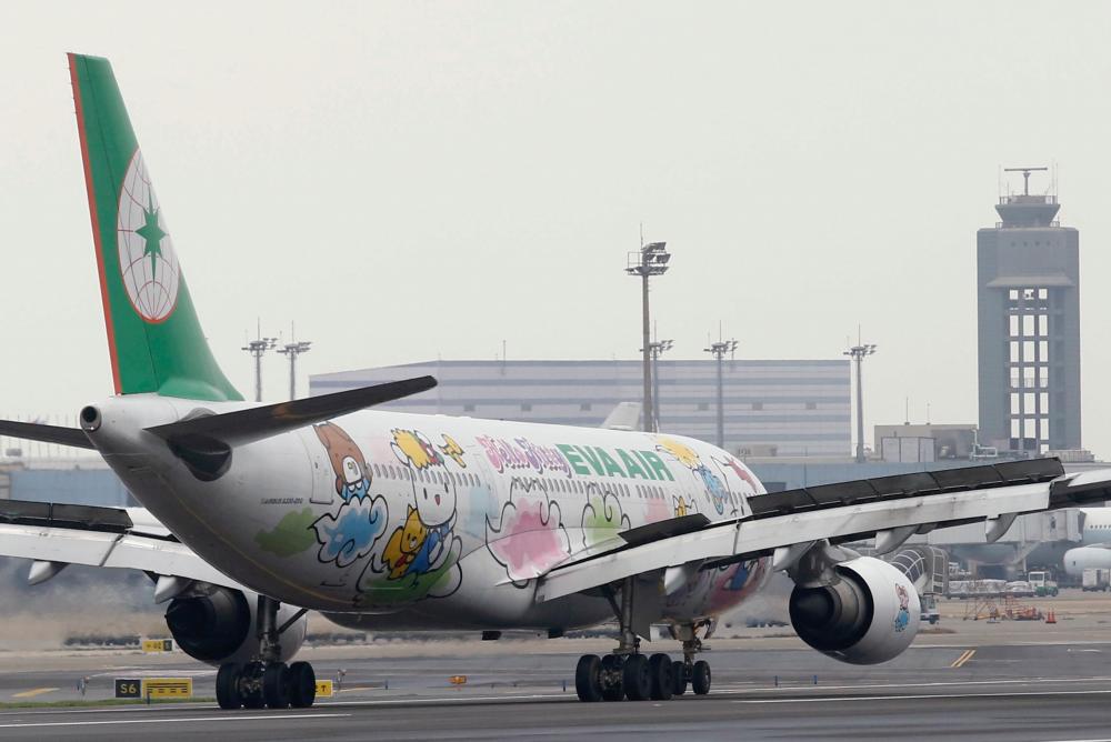 An Airbus aircraft of Taiwan's Eva Airways, owned by the Evergreen Group and decorated with Hello Kitty motifs, is seen at Taoyuan International Airport, northern Taiwan on March 14, 2016. — Reuters