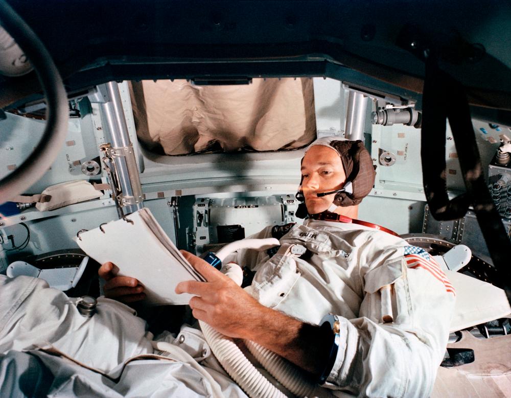 FILE PHOTO: Command Module pilot Michael Collins practices in the CM simulator at the Kennedy Space Center ahead of the Apollo 11 moon landing mission, in Cape Canaveral, Florida, June 19, 1969. -NASA/Handout via Reuters