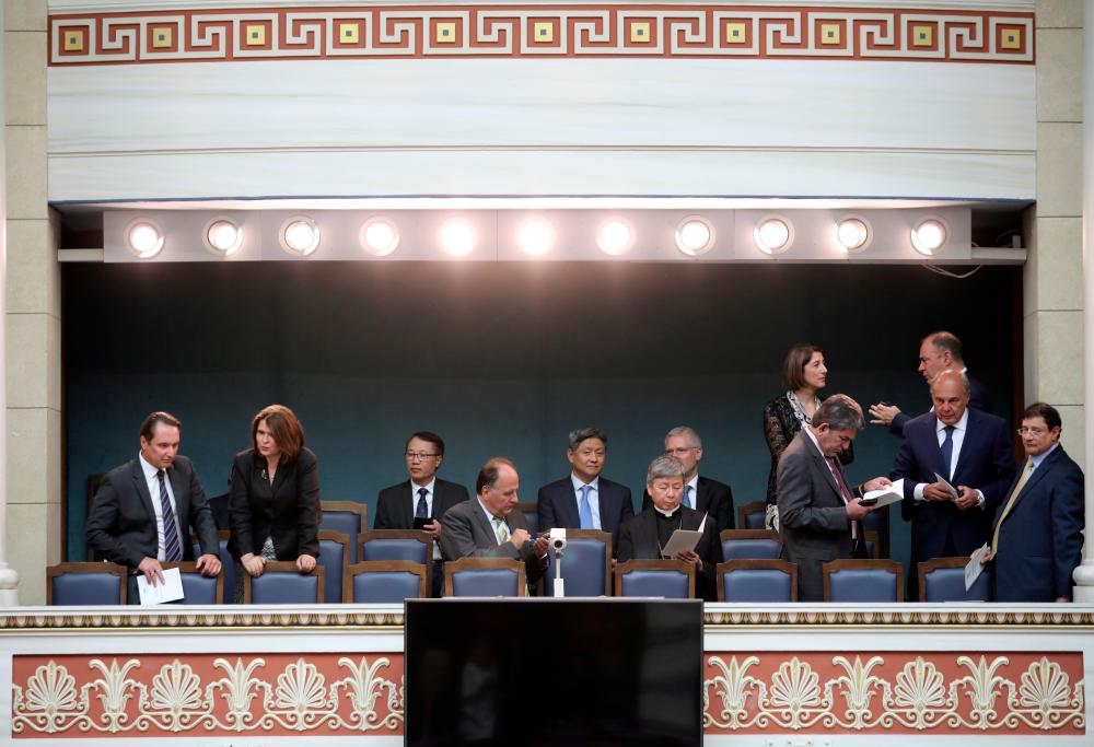 Diplomats and officials are seen before a swearing-in ceremony of the newly-elected lawmakers at the Greek parliament in Athens, Greece, July 17, 2019. — Reuters