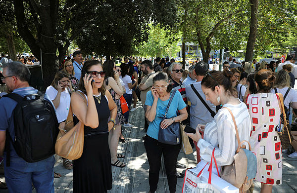 People are seen on the Syntagma Square following the evacuation of nearby buildings after an earthquake in Athens, Greece, July 19, 2019. — Reuters