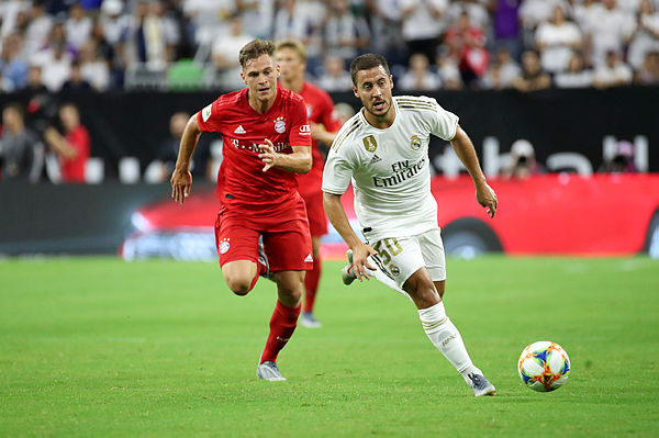 Real Madrid forward Eden Hazard (50) controls the ball as Bayern Munich defender Joshua Kimmich (32) chases during the first half of the International Champions Cup soccer series at NRG Stadium, Houston, Texas yesterday.