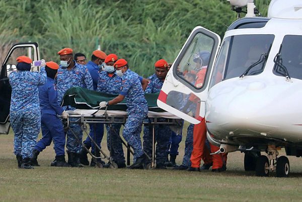 A body believed to be 15-year-old Irish girl Nora Anne Quoirin who went missing is brought out of a helicopter in Seremban, Aug 13, 2019. — Reuters