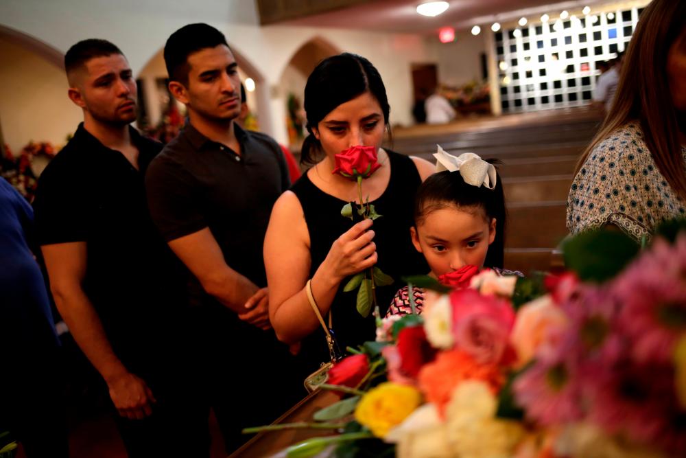 Mourners attend the public visitation service of Walmart shooting victim Margie Reckard, to which her husband Antonio Basco had invited the community in El Paso, Texas, US Aug 16, 2019. — Reuters